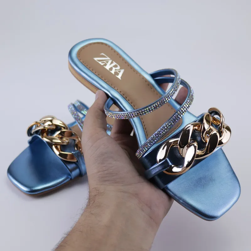 Sparkling Statement Sandals: Flat Heels with Gold Chains and Rhinestones